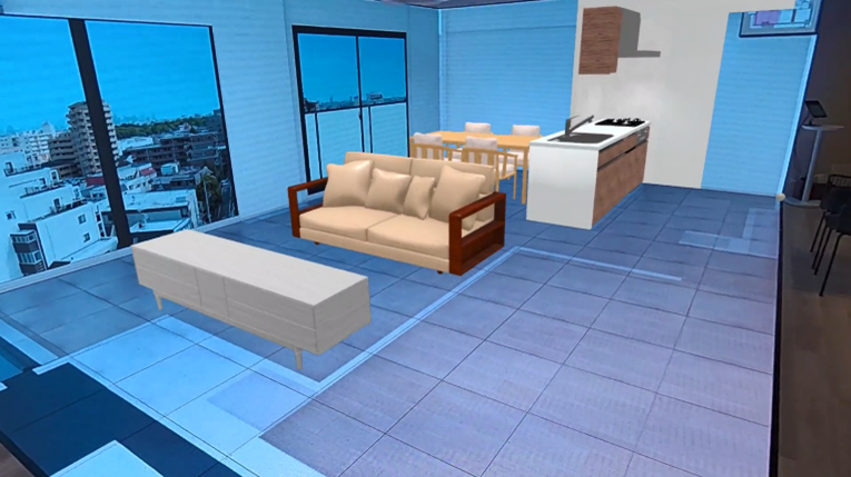 日本初(※1) 家具や住宅設備の立体視を可能とするMixed Reality(※２)を用いたモデルルーム案内　開始のサブ画像3_VRモデルルーム上にMRを用いて3D家具を投影した様子